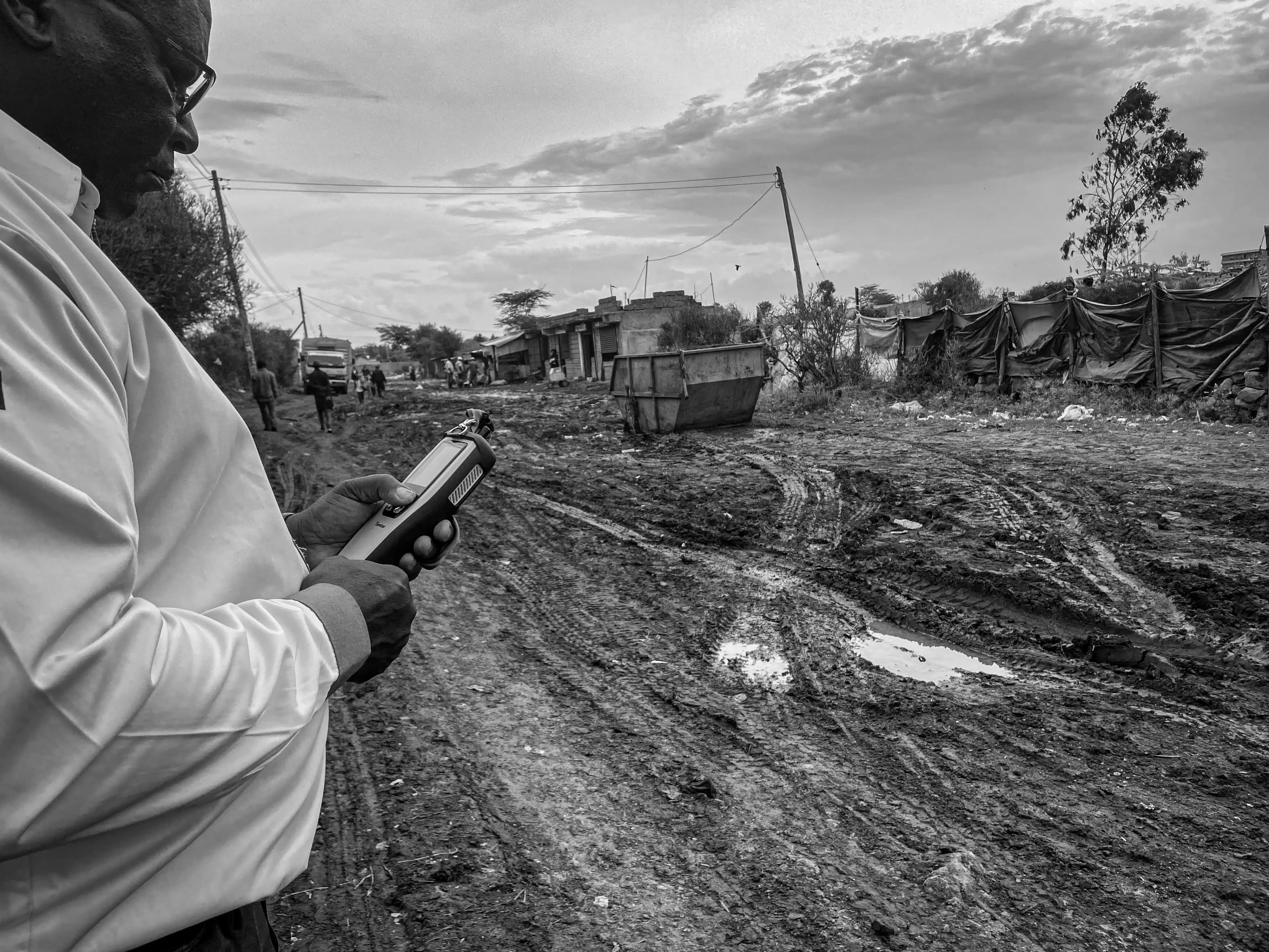 Environmental surveys — Dr. Paul Njogu installing air quality monitoring sensors